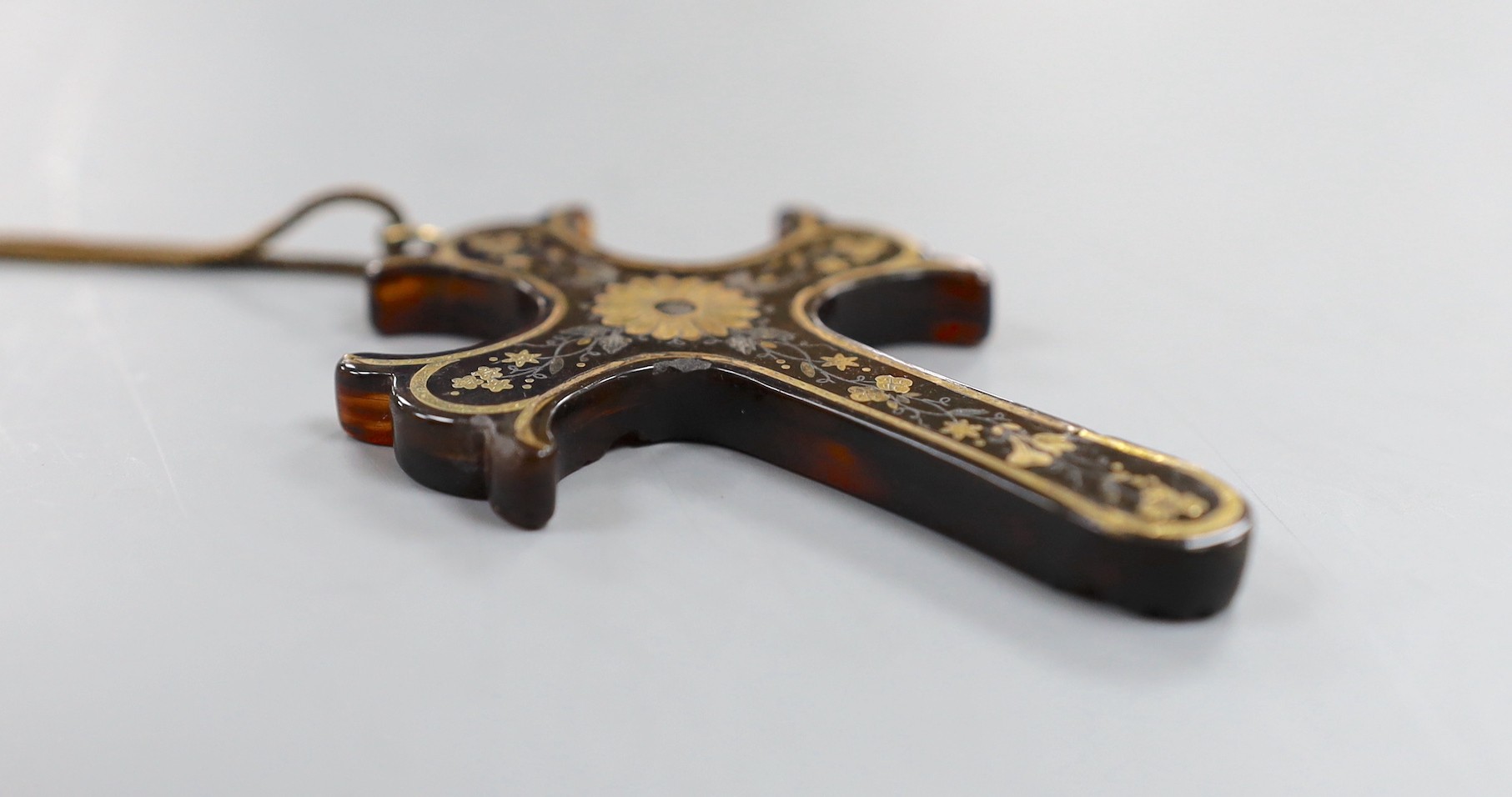 A Victorian tortoiseshell and yellow metal pique cross pendant, 73mm, on a gilt metal chain.